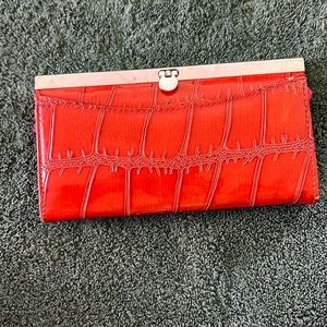 Avenue red faux crocodile clutch bag
